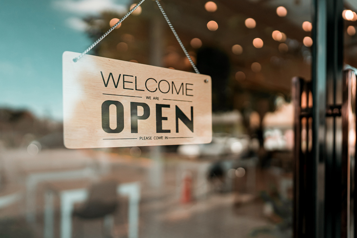 Open sign in the door of a local Kentucky business.