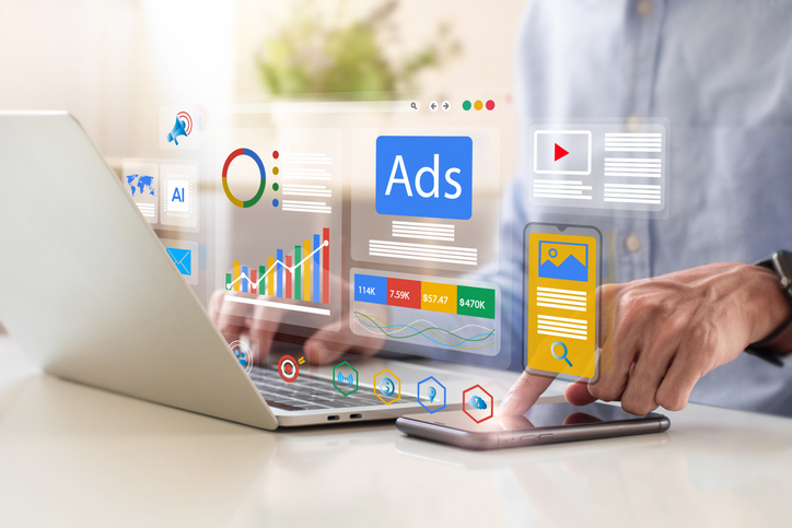 Marketing and advertising images float above a laptop computer and mobile device.